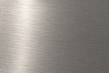 Acier brossé satiné sous lumière rasante